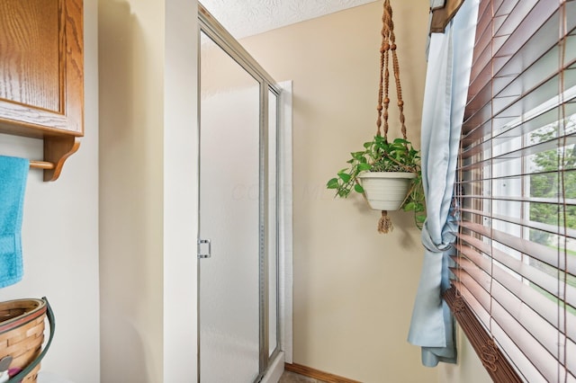 8177 Maugham Dr, Reynoldsburg, OH 43068 - bathroom featuring a stall shower and baseboards