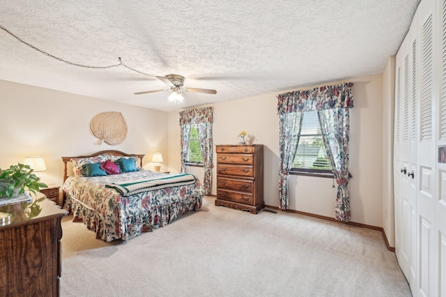 8177 Maugham Dr, Reynoldsburg, OH 43068 - carpeted bedroom with a closet, a textured ceiling, ceiling fan, and baseboards