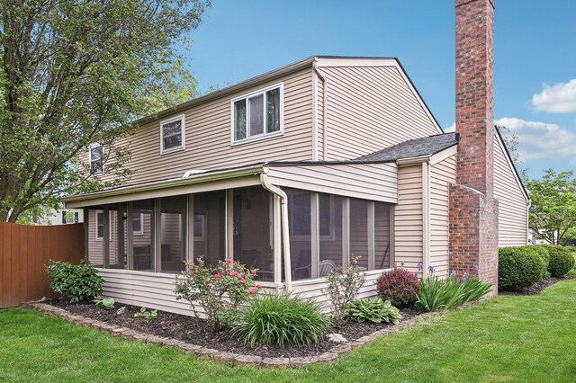 8177 Maugham Dr, Reynoldsburg, OH 43068 - view of property exterior featuring a sunroom and a chimney