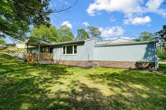 12323 Ringer Ln, Leesburg, OH 45135 - rear view of property with a lawn, covered porch, and central AC