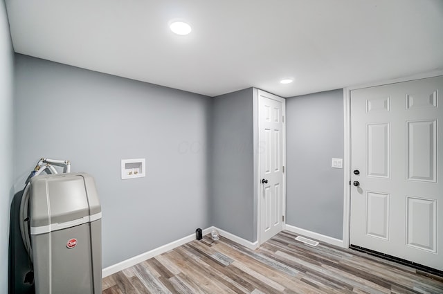 12323 Ringer Ln, Leesburg, OH 45135 - laundry room with hookup for a washing machine, baseboards, light wood-type flooring, and recessed lighting