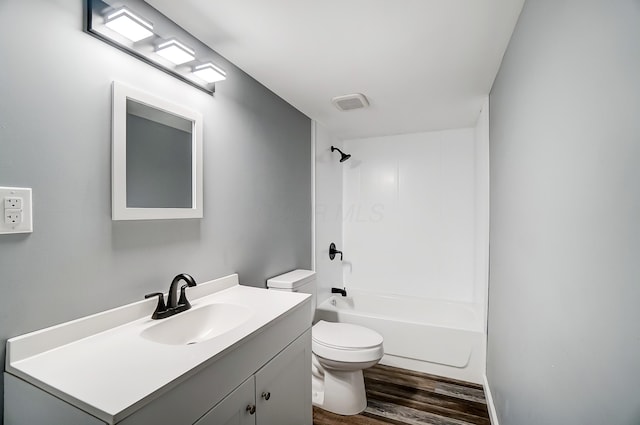 12323 Ringer Ln, Leesburg, OH 45135 - bathroom with wood finished floors, toilet, vanity, and tub / shower combination