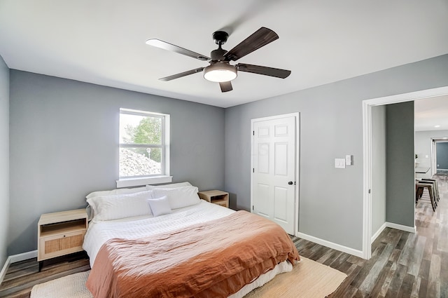 12323 Ringer Ln, Leesburg, OH 45135 - bedroom with baseboards, wood finished floors, and ceiling fan