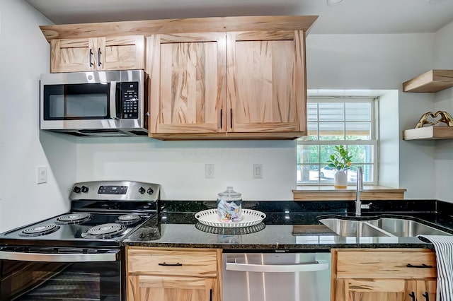 12323 Ringer Ln, Leesburg, OH 45135 - kitchen with appliances with stainless steel finishes, light brown cabinets, a sink, and dark stone counters