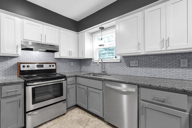 11831 Woodbridge Ln NW, Baltimore, OH 43105 - kitchen featuring under cabinet range hood, stainless steel appliances, and gray cabinets