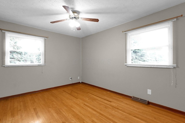11831 Woodbridge Ln NW, Baltimore, OH 43105 - empty room with light wood-style flooring, baseboards, and ceiling fan