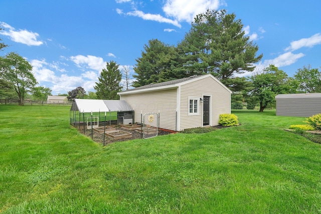 11831 Woodbridge Ln NW, Baltimore, OH 43105 - view of yard featuring an outdoor structure and a vegetable garden