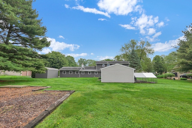 11831 Woodbridge Ln NW, Baltimore, OH 43105 - view of green lawn with an outdoor structure