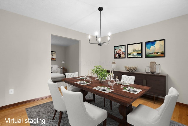 11831 Woodbridge Ln NW, Baltimore, OH 43105 - dining room with a chandelier, light wood-style flooring, and baseboards
