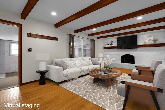 11831 Woodbridge Ln NW, Baltimore, OH 43105 - living area featuring beam ceiling, light wood-style floors, baseboards, a brick fireplace, and recessed lighting