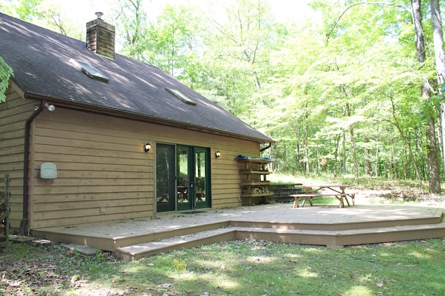 387 Mohican Ln, Sugar Grove, OH 43155 - back of property featuring a chimney, a wooden deck, french doors, and roof with shingles
