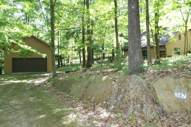 387 Mohican Ln, Sugar Grove, OH 43155 - view of yard featuring a garage