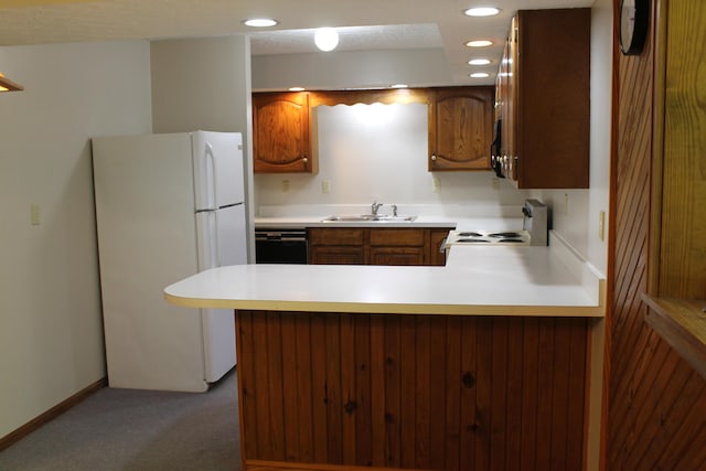 387 Mohican Ln, Sugar Grove, OH 43155 - kitchen with white appliances, carpet, light countertops, a peninsula, and a sink