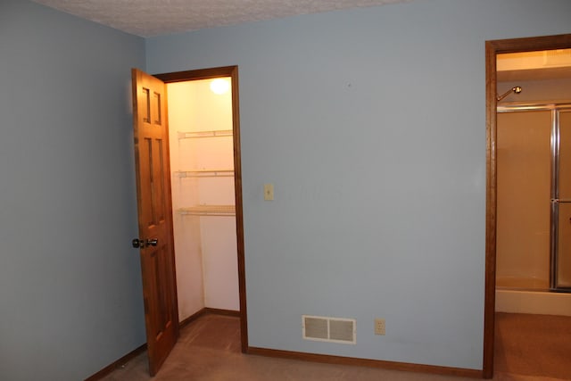 387 Mohican Ln, Sugar Grove, OH 43155 - unfurnished bedroom featuring carpet, baseboards, and a textured ceiling