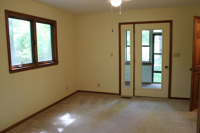 387 Mohican Ln, Sugar Grove, OH 43155 - spare room with light carpet, baseboards, and ceiling fan