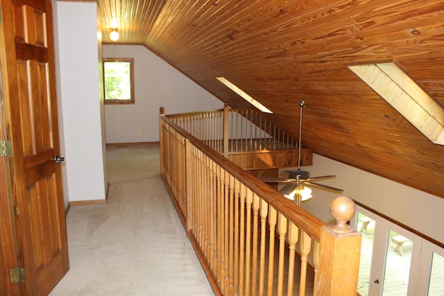 387 Mohican Ln, Sugar Grove, OH 43155 - corridor featuring wood ceiling, vaulted ceiling, an upstairs landing, baseboards, and light colored carpet