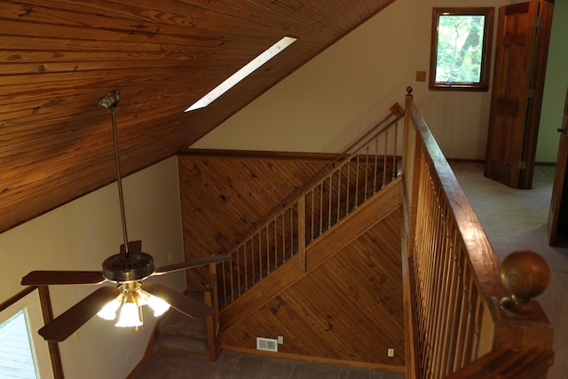 387 Mohican Ln, Sugar Grove, OH 43155 - stairway featuring ceiling fan, lofted ceiling, wooden ceiling, carpet floors, and wood walls