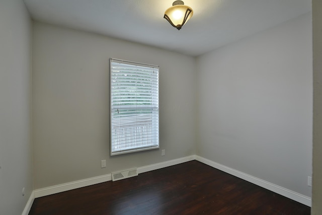 6219 Ambleside Dr, Columbus, OH 43229 - empty room with dark wood-style flooring and baseboards