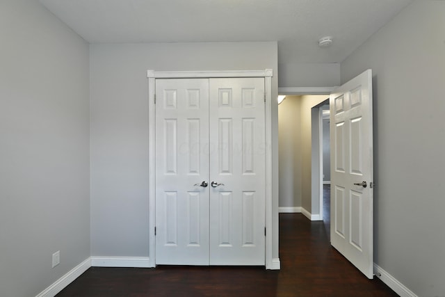 6219 Ambleside Dr, Columbus, OH 43229 - unfurnished bedroom with wood finished floors, baseboards, and a closet