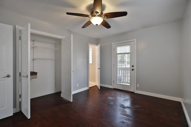 6219 Ambleside Dr, Columbus, OH 43229 - unfurnished bedroom with wood finished floors, baseboards, a ceiling fan, and a closet