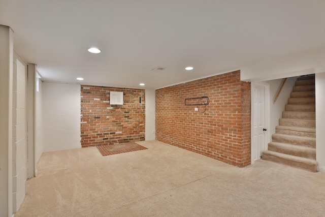 6219 Ambleside Dr, Columbus, OH 43229 - finished basement featuring brick wall, carpet floors, stairs, and recessed lighting