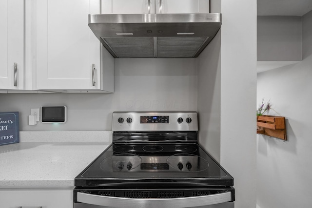 690 Reinhard Ave, Columbus, OH 43206 - kitchen featuring electric stove, ventilation hood, white cabinets, and light stone countertops