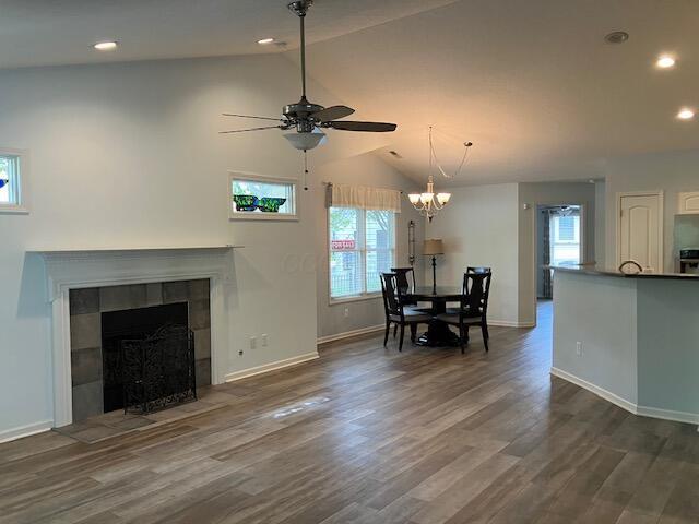 7343 Reynolds Crossing Dr, Reynoldsburg, OH 43068 - dining room with lofted ceiling, a ceiling fan, dark wood-type flooring, baseboards, and recessed lighting