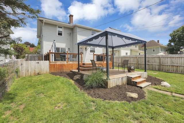 207 Jefferson Rd, Newark, OH 43055 - back of property with a chimney, a gazebo, and a wooden deck