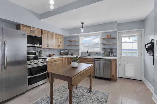 207 Jefferson Rd, Newark, OH 43055 - kitchen featuring appliances with stainless steel finishes, open shelves, a sink, and light tile patterned floors