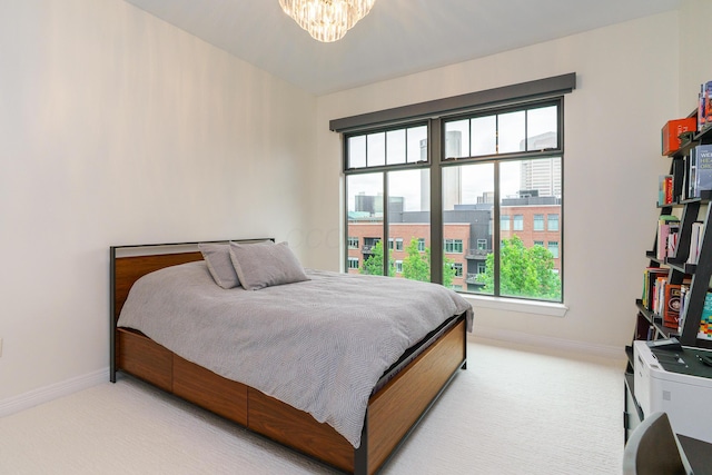 251 Daniel Burnham Sq Unit 703, Columbus, OH 43215 - bedroom with light colored carpet, baseboards, and multiple windows