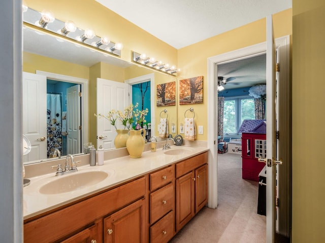 8171 Campden Lakes Blvd, Dublin, OH 43016 - bathroom with double vanity, a ceiling fan, and connected bathroom