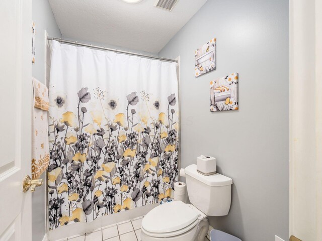8171 Campden Lakes Blvd, Dublin, OH 43016 - full bathroom with toilet, a shower with shower curtain, and tile patterned floors