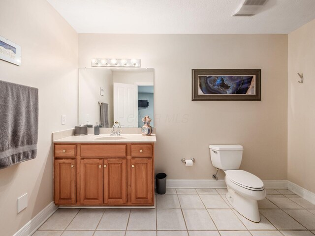 8171 Campden Lakes Blvd, Dublin, OH 43016 - bathroom featuring toilet, vanity, tile patterned flooring, and baseboards