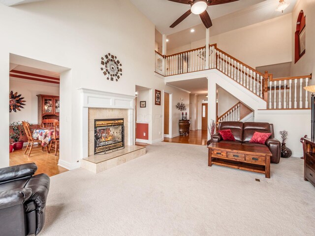 8171 Campden Lakes Blvd, Dublin, OH 43016 - carpeted living area with a towering ceiling, ceiling fan, recessed lighting, a fireplace, and baseboards