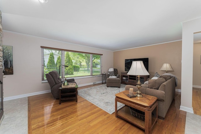 4015 Mountview Rd, Upper Arlington, OH 43220 - living room featuring crown molding, light wood-style flooring, and baseboards