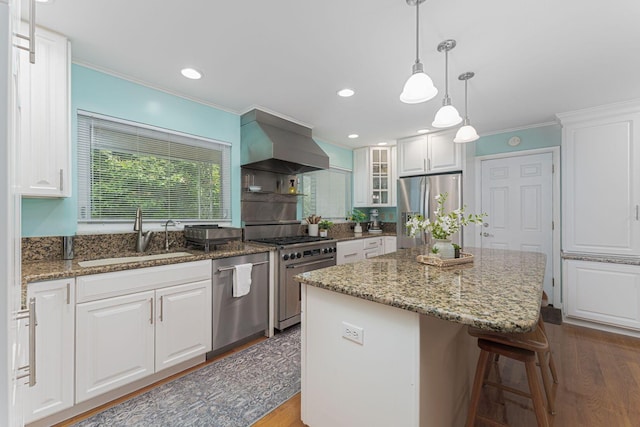 4015 Mountview Rd, Upper Arlington, OH 43220 - kitchen featuring appliances with stainless steel finishes, wall chimney exhaust hood, a sink, ornamental molding, and dark wood-style flooring