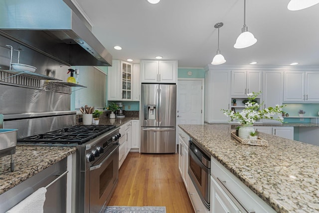 4015 Mountview Rd, Upper Arlington, OH 43220 - kitchen featuring stainless steel appliances, extractor fan, white cabinetry, light wood finished floors, and pendant lighting
