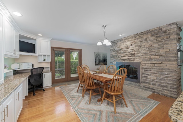 4015 Mountview Rd, Upper Arlington, OH 43220 - dining area featuring a chandelier, light wood-type flooring, a large fireplace, and recessed lighting