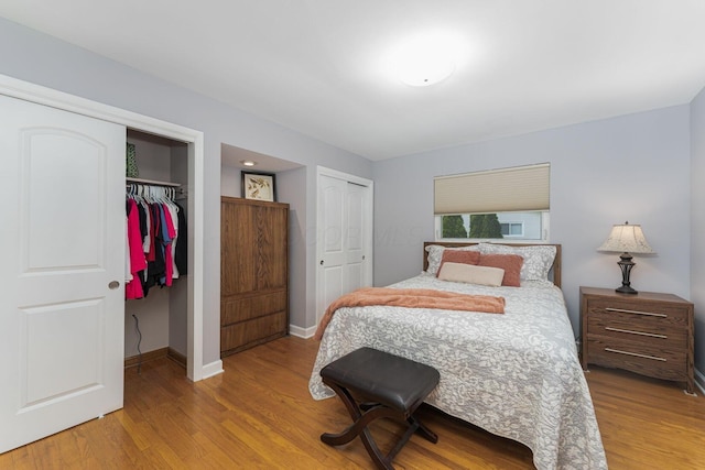 4015 Mountview Rd, Upper Arlington, OH 43220 - bedroom with two closets, wood finished floors, and baseboards