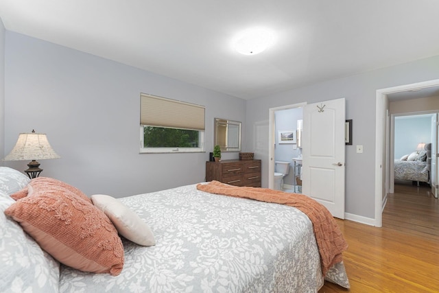 4015 Mountview Rd, Upper Arlington, OH 43220 - bedroom with light wood-type flooring, baseboards, and connected bathroom
