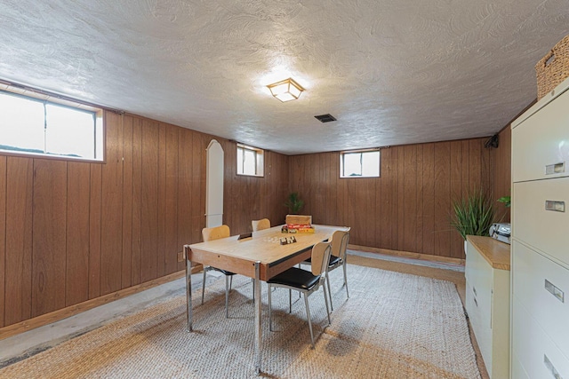 4015 Mountview Rd, Upper Arlington, OH 43220 - dining area with wooden walls, a textured ceiling, and baseboards