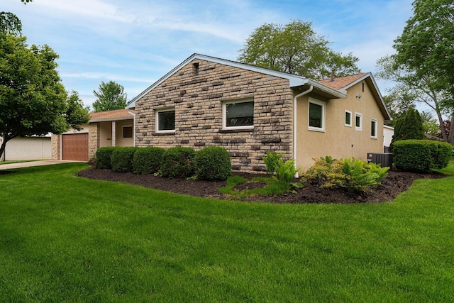 4015 Mountview Rd, Upper Arlington, OH 43220 - view of home's exterior featuring stone siding, a yard, a garage, and stucco siding