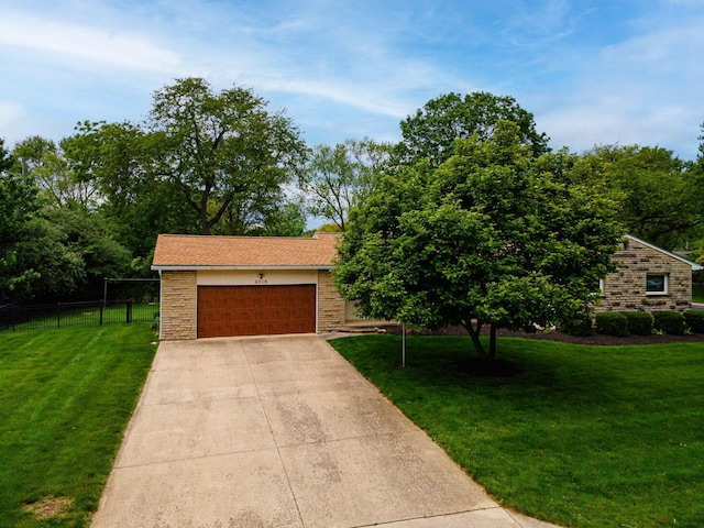 4015 Mountview Rd, Upper Arlington, OH 43220 - view of front of home featuring stone siding, concrete driveway, and a garage