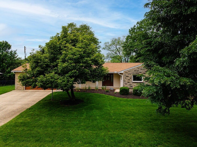 4015 Mountview Rd, Upper Arlington, OH 43220 - view of front of home with stone siding, a front lawn, and driveway