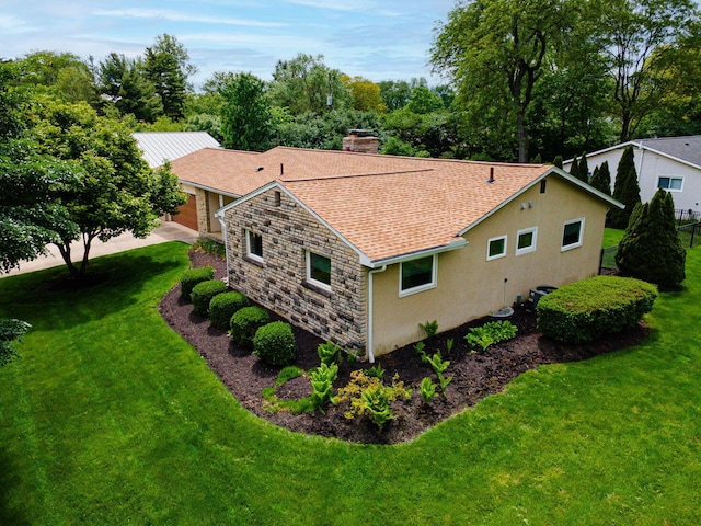 4015 Mountview Rd, Upper Arlington, OH 43220 - view of property exterior with a lawn, stone siding, stucco siding, and a chimney