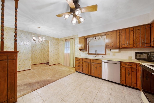 2580 Applewood Ln NE, Lancaster, OH 43130 - kitchen with dishwasher, black microwave, light countertops, brown cabinetry, and wallpapered walls