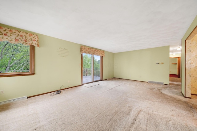 2580 Applewood Ln NE, Lancaster, OH 43130 - unfurnished living room featuring carpet and baseboards