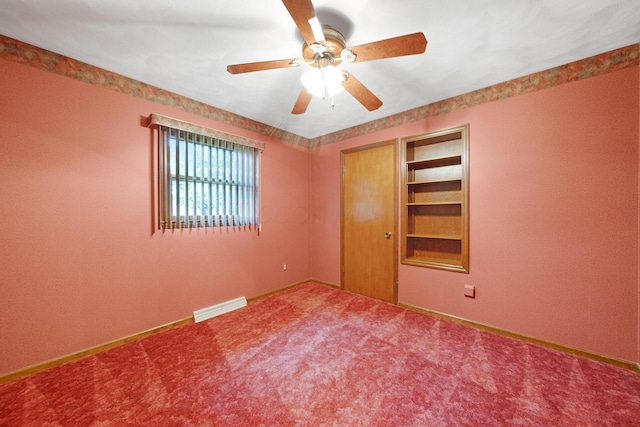 2580 Applewood Ln NE, Lancaster, OH 43130 - spare room featuring ceiling fan, carpet, baseboards, and built in shelves