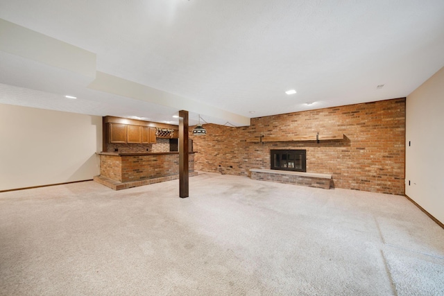 2580 Applewood Ln NE, Lancaster, OH 43130 - unfurnished living room with brick wall, light carpet, a brick fireplace, baseboards, and recessed lighting