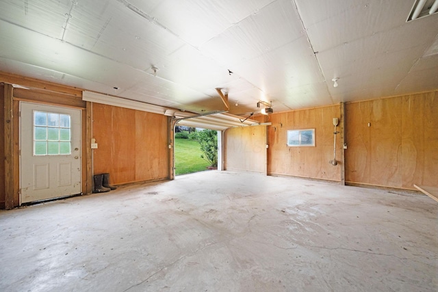 2580 Applewood Ln NE, Lancaster, OH 43130 - garage with wooden walls and a garage door opener